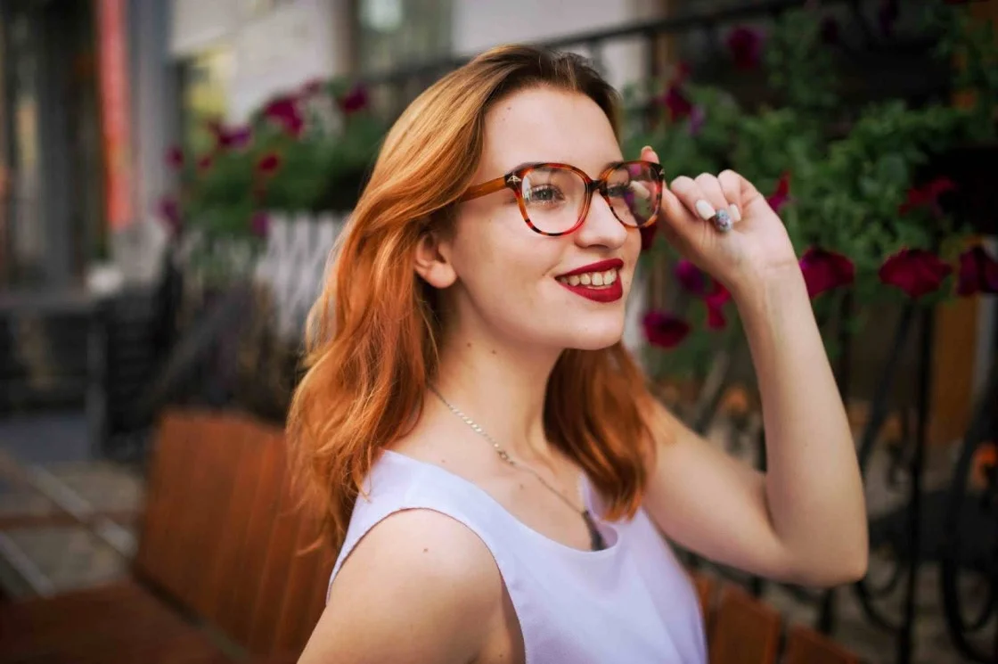 girl wearing a red framed glasses
