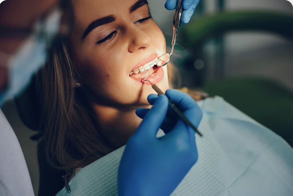 A dentist examining a patient's teeth